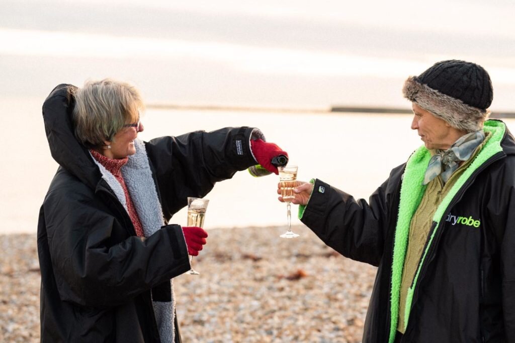 Things-to-do-in-lyme-regis drinking LBW fizz on beach