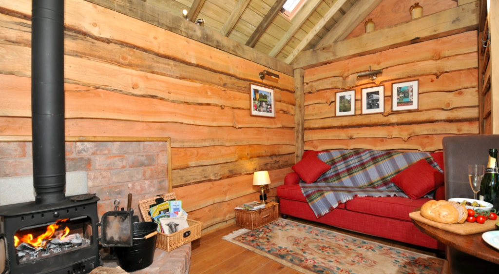 Copperbeech Bowtop Log Cabin and Gypsy Caravan, inside cabin lounge