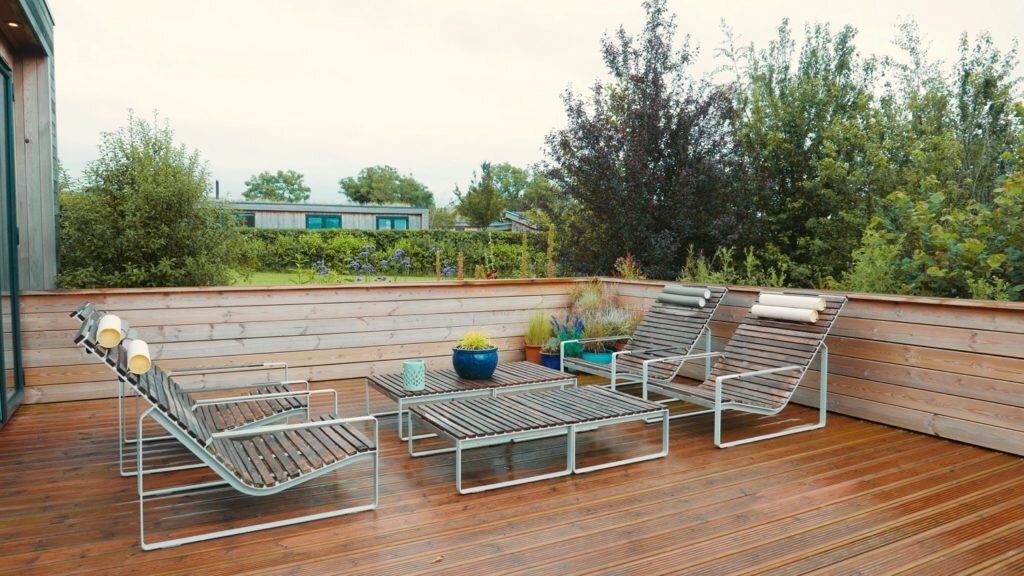 Strawberryfield Eco Lodges in Somerset - deck and loungers