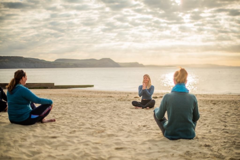 yoga with pip from Maitri Yoga on Lyme Regis beach