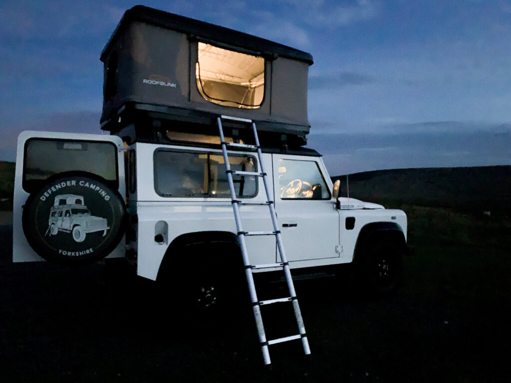 defender-camping - yorkshire vehicle hire: tent box at night