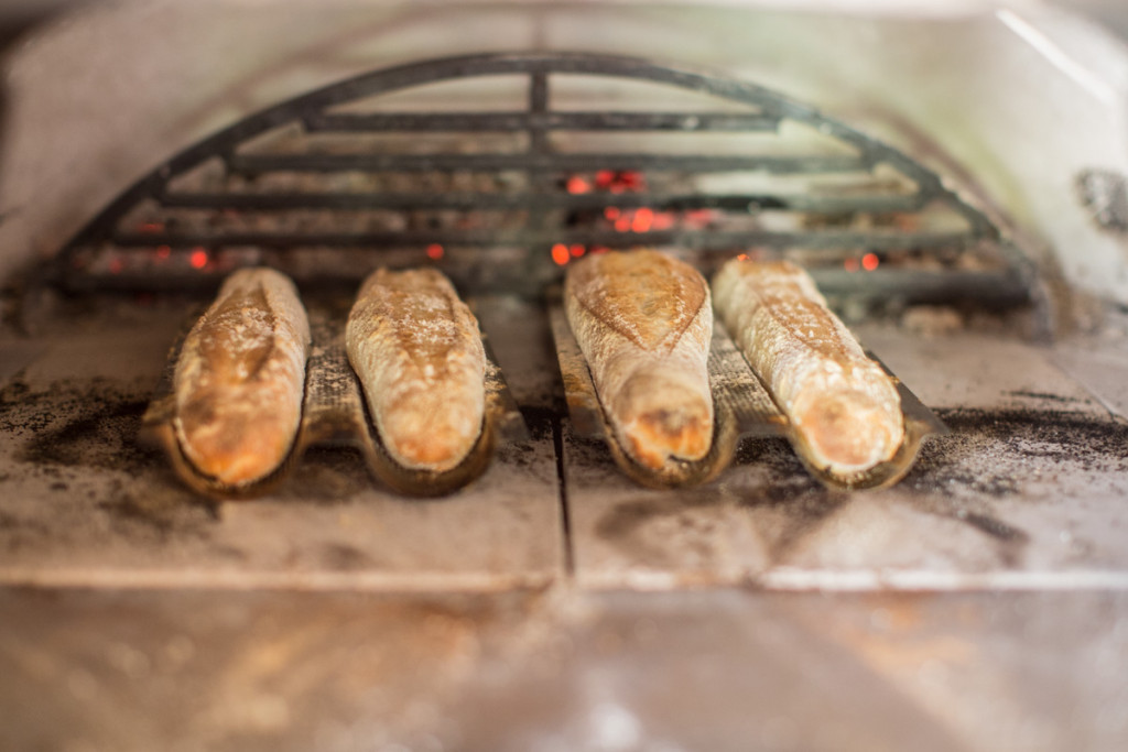 bakehouse west sussex - glamping and baking experiences - bread in oven