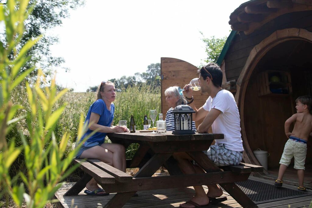 camping near york - hobbit house and family in sun