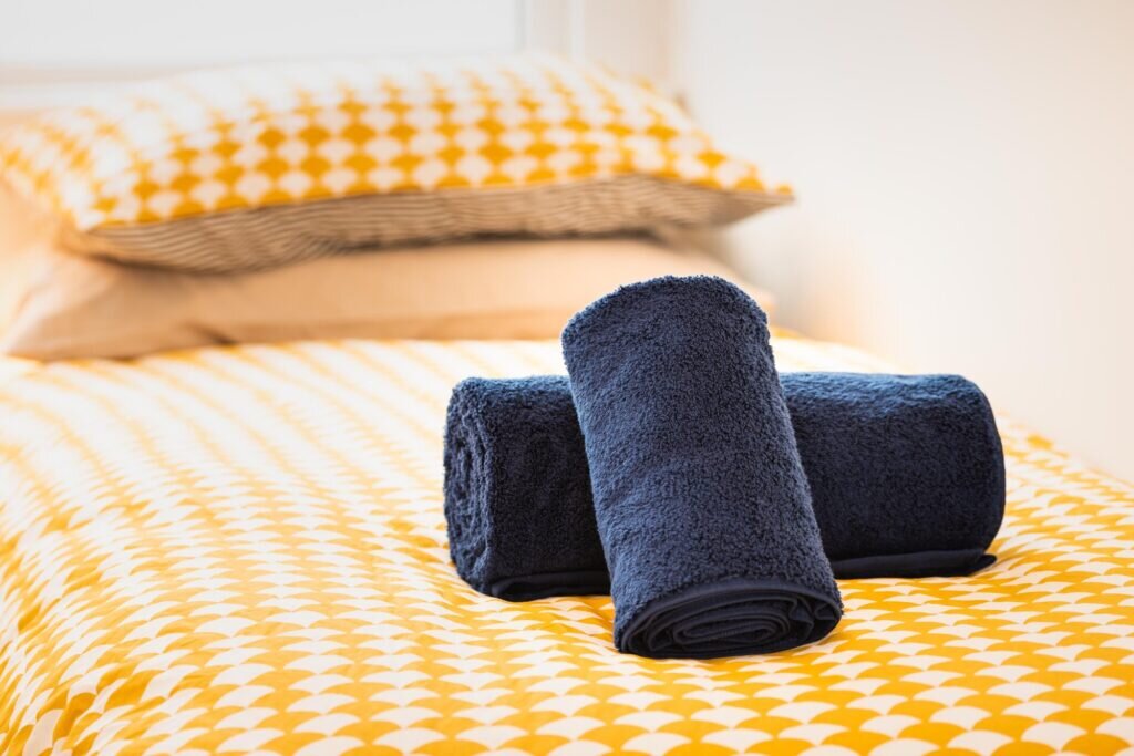 dog-friendly accommodation lyme regis towels on bed