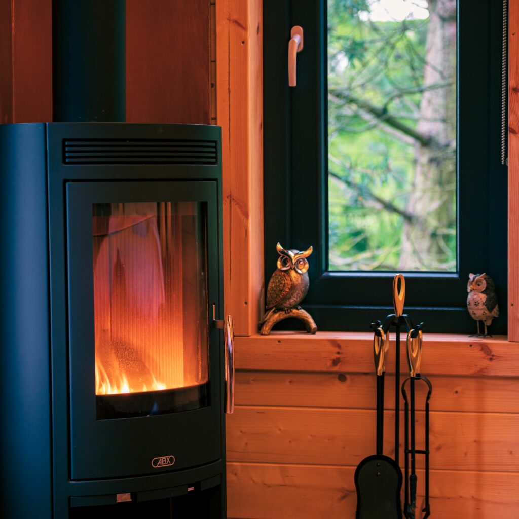 hawthorn hideaway glamping nottinghamshire - owl lodge fire