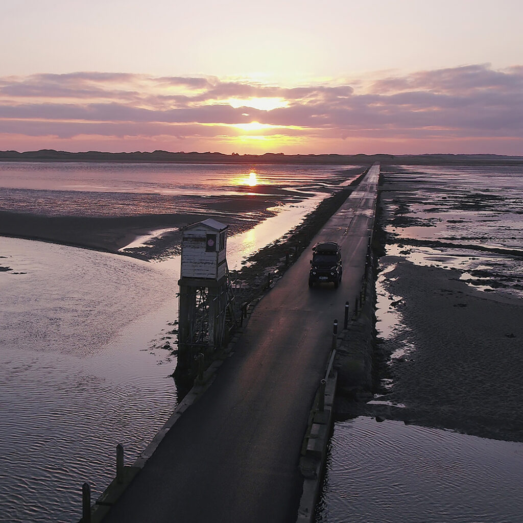 landrover defender camping in holy island northumberland