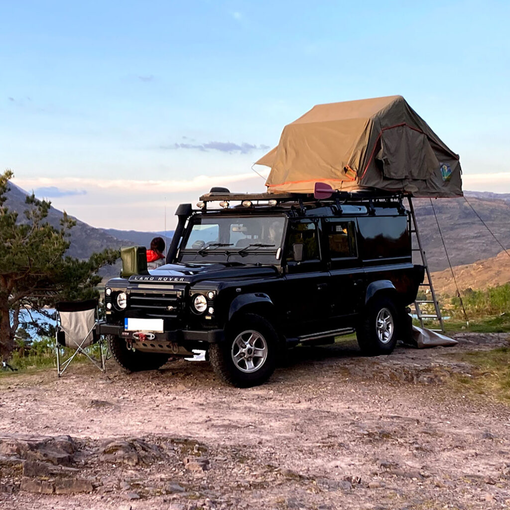 landrover defender camping tent set-up on beach