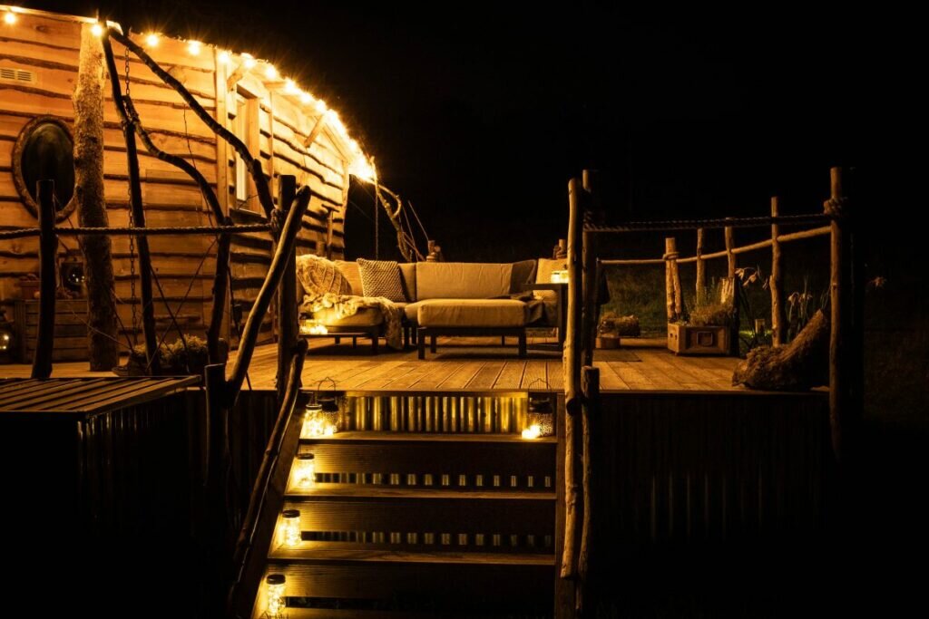 log cabins Carmarthenshire: Erwain Escapes - deck at night