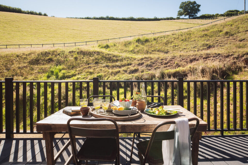 converted barn holidays: redbrick barn devon exterior dining outdoors